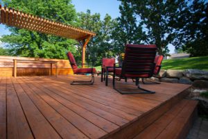 Deck Stain Project completed of a backyard deck